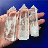 Moonlight Gemstones clear quartz obelisk towers, set of 3, translucent with visible inclusions.
