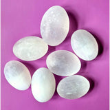 Selenite palm stones by Moonlight Gemstones; white translucent crystals for stress relief