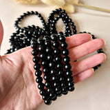 Edelsteen armband met 8mm zwarte obsidiaan kralen van Moonlight Gemstones