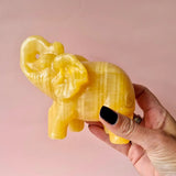 Yellow calcite elephant crystal sculpture, 10–12 cm, about 650 g