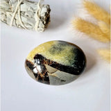 Septarian palmstone by Moonlight Gemstones with yellow, olive, and black banded patterns
