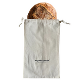green-goose Bio cotton bread bag holding a rustic loaf