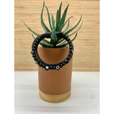 Gevlochten leren armband met zwarte turksoog - mystieke elegantie en bescherming X6