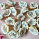 White agate geodes with sparkling druzy interiors; Moonlight Gemstones, 5–7 cm, multiple pieces