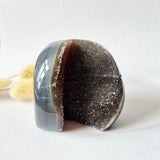 Druzy agate geode from Uruguay, 410 g, blue-gray exterior with dark sparkly druzy interior