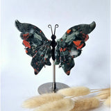 African bloodstone butterfly on stand, hand-carved gemstone sculpture with green-black stone and red speckles, 12–14 cm.
