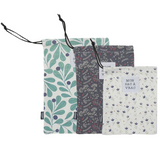Cotton bread bags set of 3 by green-goose, teal leaf print, navy floral print, and white floral print with drawstrings.