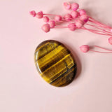 Tiger's Eye worry stone by Moonlight Gemstones, oval polished thumb stone with golden-brown striped bands