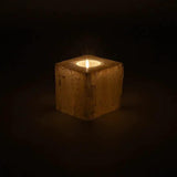 Selenite cube candle holder with lit tealight, 8–10 cm, natural pale stone