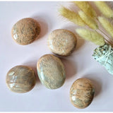 Peach moonstone palmstones, set of 5 smooth polished worry stones with peach-beige tones.