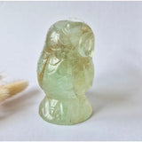 Fluorite owl gemstone carving, translucent pale green with natural inclusions, 525g