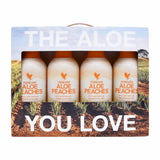 Forever Aloe Peaches 4-pack by Forever Living, peach-flavored aloe beverages in orange-labeled bottles
