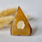 Druzy agate standing gemstone crystal, amber-orange exterior with white druzy center, 43g