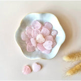 Moonlight Gemstones Mini Hart rose quartz worry stones, pink heart-shaped crystals in a white bowl with two loose hearts
