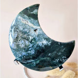 Moonlight Gemstones XL moss agate crescent moon on stand, green-blue with white druzy patterns