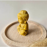 Yellow jade Buddha figurine, 7 cm, on a wooden display base