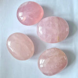Rozenkwarts jumbo trommelsteen handsteen by Moonlight Gemstones; four pink polished palmstones.