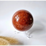 Strawberry Quartz crystal sphere by Moonlight Gemstones, red-orange polished 60–75 mm
