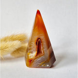 Pyramid-shaped druzy gray agate standing gemstone crystal with orange-brown hues and inner cavity, 84g