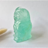 Fluorite owl gemstone carving by Moonlight Gemstones, green translucent sculpture.