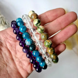 Edelsteenarmband met 8mm kralen Angeliet; set van 4 armbanden in paars, blauw, helder en groen.
