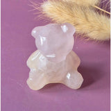 Bear-shaped rose quartz crystal carving, 4 cm, faceted pink gemstone.