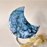 Moon-shaped blue agate druzy sculpture on stand, Moonlight Gemstones