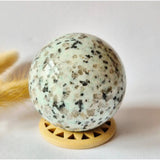 Kiwi jasper sphere 60 mm on a wooden stand, natural gemstone ball