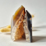 Druzy agate tower from Uruguay with orange-brown gradient and crystal interior