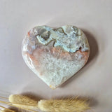 Polished druzy pink amethyst heart stone with white crystal pockets and natural banding, Moonlight Gemstones, 8–10 cm
