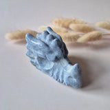 Dragon skull carving in blue aventurine, 7 cm, textured ridges and jaw teeth.