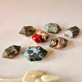 Red moss agate double-terminated wand crystals; set of eight with green, red, and white patterns.