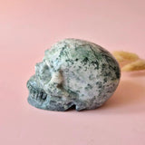Moss agate skull sculpture, XL, 10 cm, 570 g, green-white veining