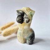 Caribbean Calcite goddess carving, 8 cm, hand-polished by Moonlight Gemstones; cream-yellow with green accents.