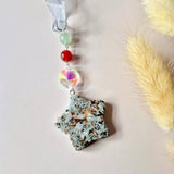 Star-shaped gemstone suncatcher pendant by Moonlight Gemstones with green bead, red bead and iridescent crystal