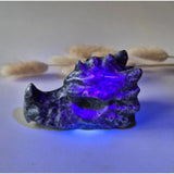 Moonlight Gemstones Yooperlite dragon skull specimen, 9 cm, glows purple under UV.