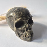 Pyriet Skull, 690 g, hand-carved crystal skull in dark metallic gray by Moonlight Gemstones