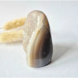 Druzy agate geode from Uruguay, 173 g, polished brown banded exterior with white crystal interior