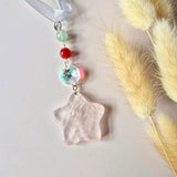 Moonlight Gemstones Christmas star suncatcher with mint green bead, red bead, iridescent crystal and pink star pendant