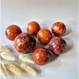 Fire Quartz Kristallen Bol – 50mm Hematoïde Kwarts spheres, set of 7 by Moonlight Gemstones