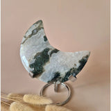 Moon-shaped agate moon on stand from Moonlight Gemstones with druzy patterns and green inclusions, 240g.