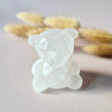 Crystal bear carving in bergkristall quartz; translucent with smooth facets.
