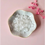 Bergkristal clear quartz star confetti in a ceramic dish, Moonlight Gemstones