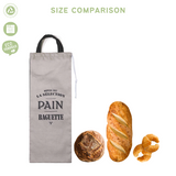 green-goose katoenen broodzak XXL 27x70 cm, zwart/wit; beige bag with black handles beside baguette and round loaf