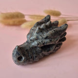Yooperlite dragon skull carving pendant by Moonlight Gemstones, 8 cm, gray-blue with black speckles