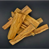 Palo Santo wood sticks by Moonlight Gemstones for crystal cleansing in warm golden-brown tones
