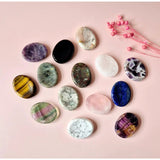 Amethyst worry stone by Moonlight Gemstones; set of 15 polished stones in purple, green, white, pink and blue.