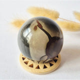 Ocean Jasper polychrome gemstone sphere 50mm in red/orange with a unique pattern