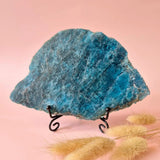 Moonlight Gemstones XXL blue apatite slab on stand, 331g, displayed on pink background