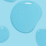 Isle of Paradise Hyglo Body Serum blue gel droplets on a light blue background.